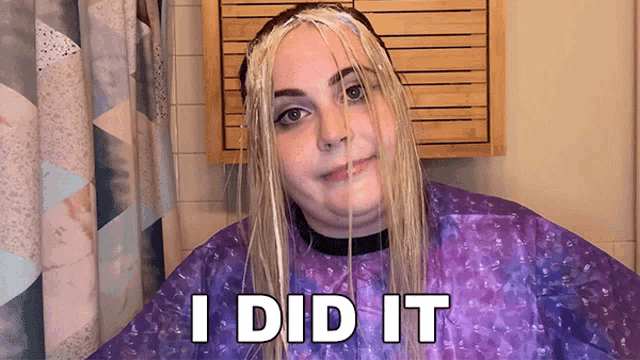 a woman wearing a purple cape with the words i did it on it