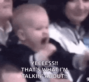 a baby is screaming in a crowd of people while sitting in a chair .