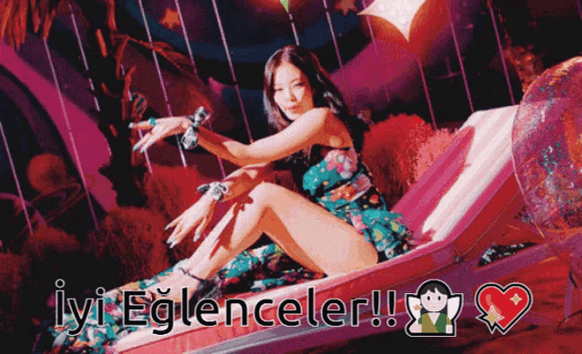 a woman in a floral dress is sitting on a lounge chair with the words iyi eğlenceler written below her