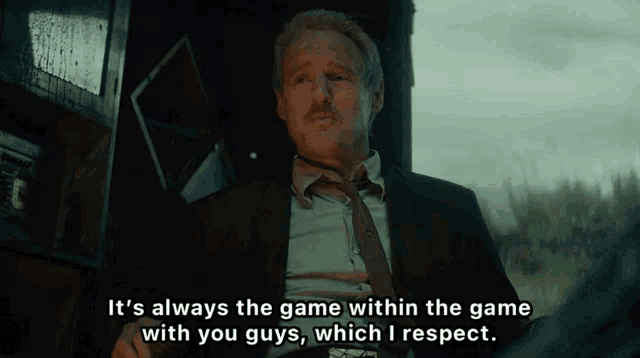 a man in a suit and tie says " it 's always the game within the game with you guys "