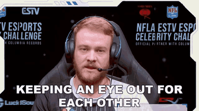 a man wearing headphones with the words keeping an eye out for each other