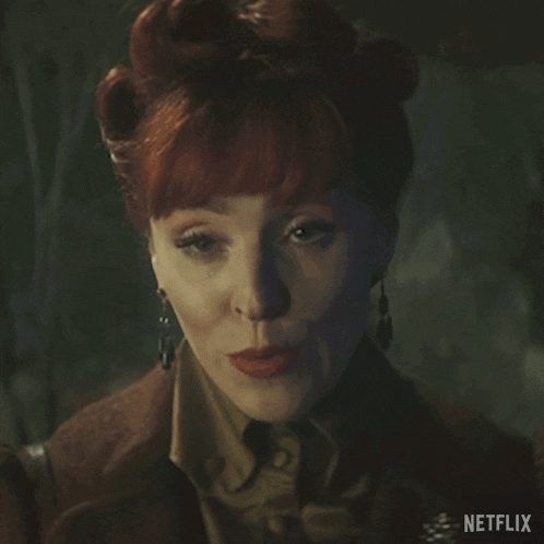 a woman with red hair is making a face with the words really on it