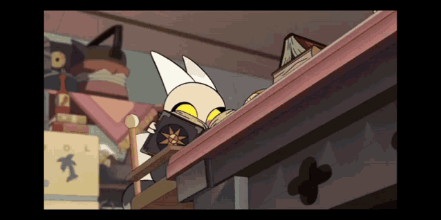 a cartoon cat is sitting on a table reading a book