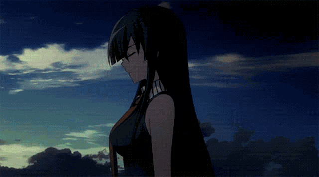 a woman with long black hair is standing in front of a blue sky