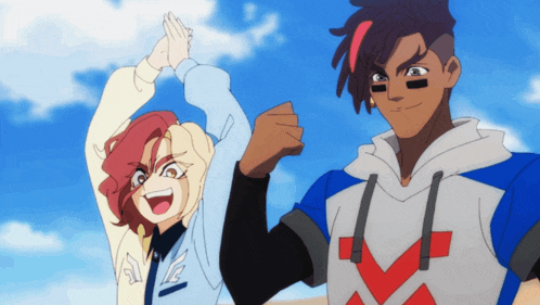 a boy and a girl are standing next to each other with their arms in the air