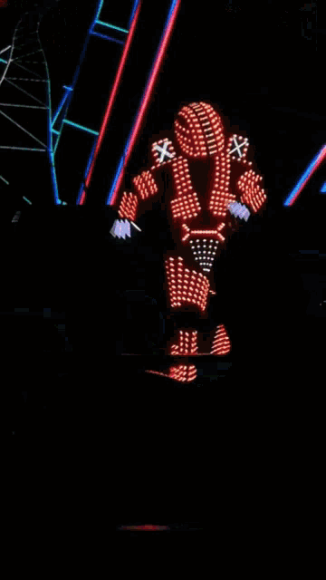 a silhouette of a person in front of a screen with a robot on it