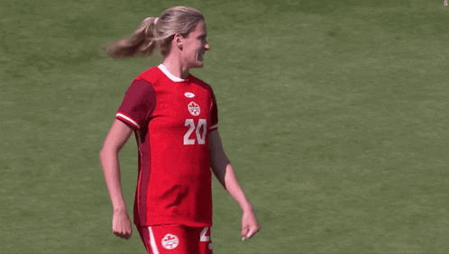 a female soccer player with the number 20 on her shirt