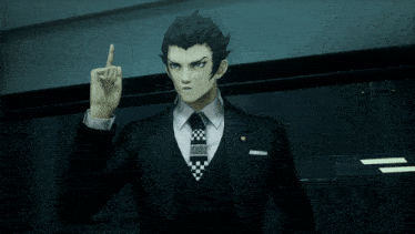 a man in a suit and tie points up with his finger