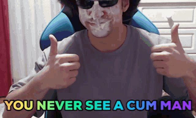 a man giving a thumbs up with the words you never see a cum man