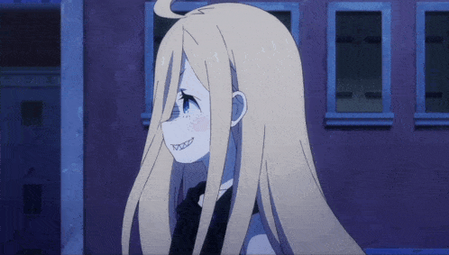a girl with long blonde hair is smiling in front of a purple wall