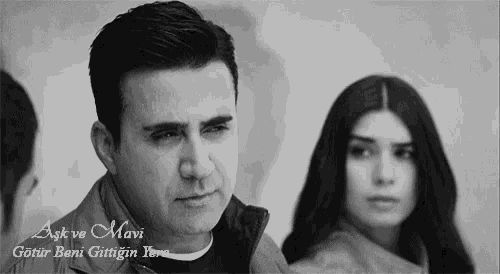 a black and white photo of a man and a woman with the words aşk ve mavi