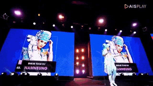 bnk48 team nv namneung is on a stage