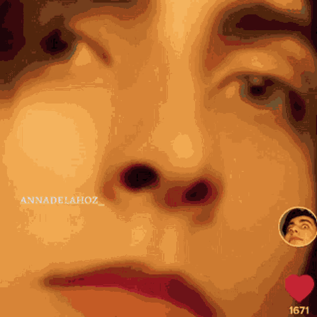 a close up of a person 's face with the name annadelahoz