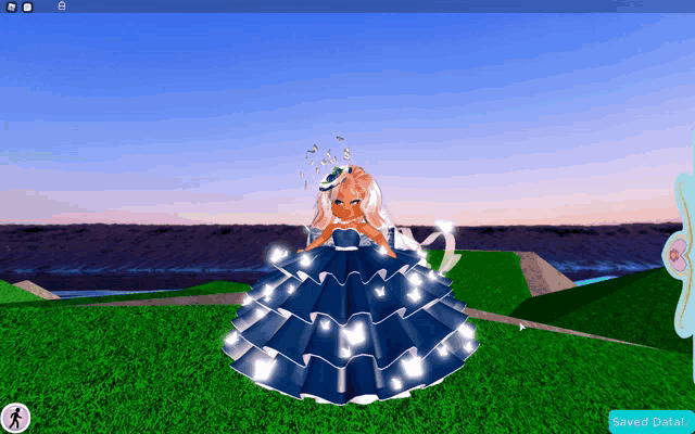 a girl in a blue dress is standing in a grassy field with a saved data button