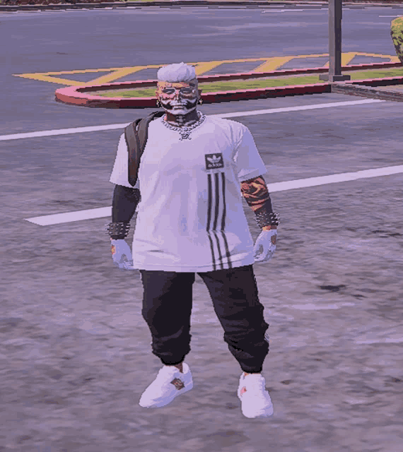 a man wearing a white adidas t-shirt is standing on a street