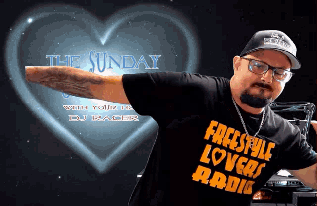 a man wearing a shirt that says freestyle lovers radio stands in front of a heart