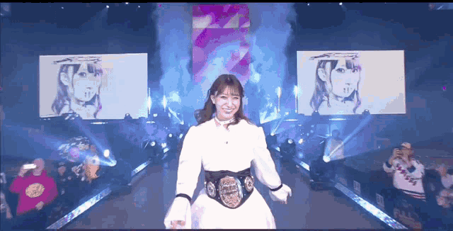a woman in a white dress is wearing a belt that says world heavyweight champion