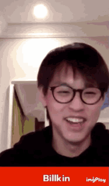 a man wearing glasses is smiling with the name billkin on the bottom right