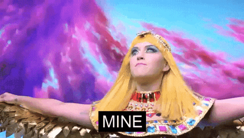 a woman in a costume with the word mine above her head