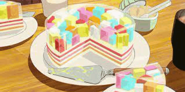a colorful cake with a slice taken out of it is on a plate on a wooden table .