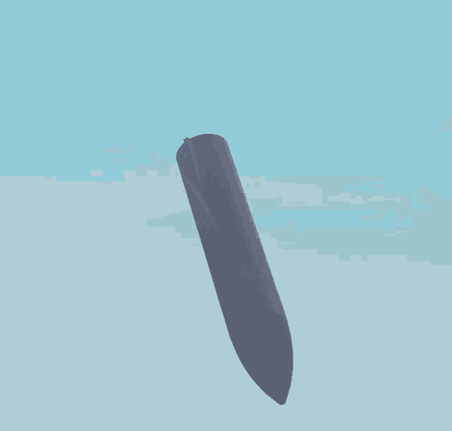 a gray object is floating in the sky