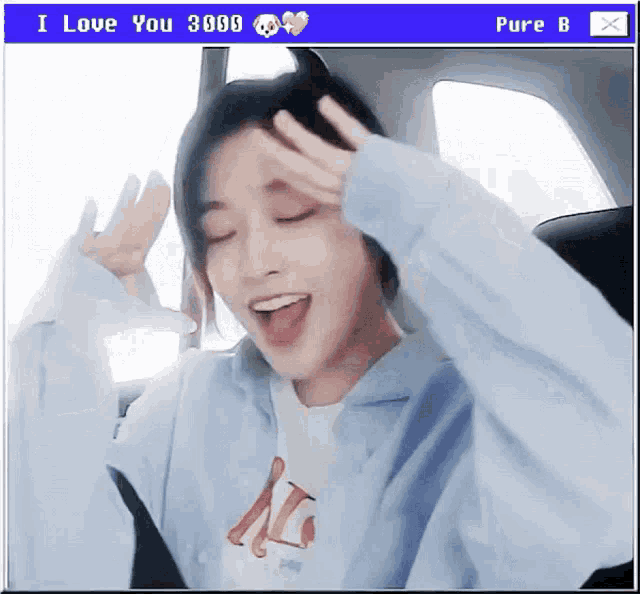 a girl in a car with a screen saying i love you 3999