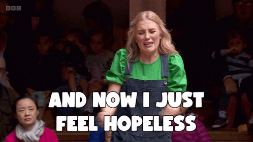 a woman in overalls is crying and says and now i just feel hopeless