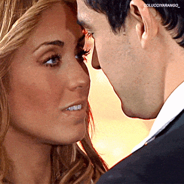 a man and a woman are touching their foreheads with the caption colucciyarango_