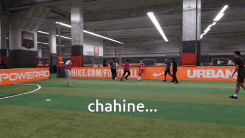 a group of people are playing soccer in front of a banner that says powerade