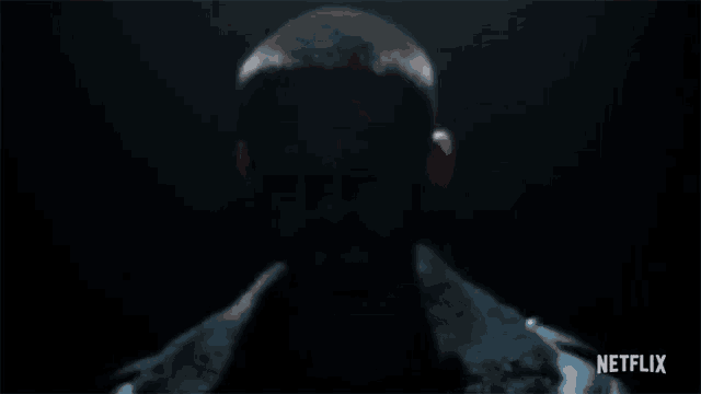 a close up of a man 's face with the word netflix on the bottom