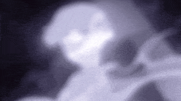 a blurry picture of a ghost with a purple background .