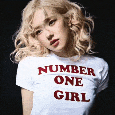 a woman wearing a number one girl t-shirt