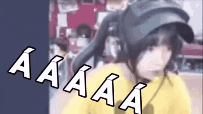 a person wearing headphones and a hat says aa aa aa aa