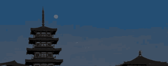 a full moon shines brightly in a dark night sky .