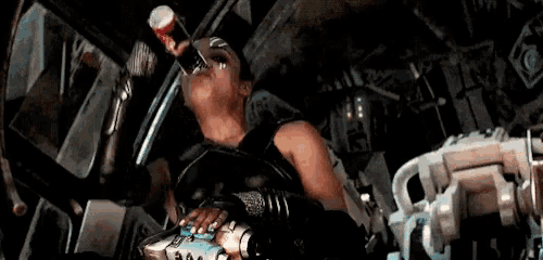 a woman is drinking from a coca cola can
