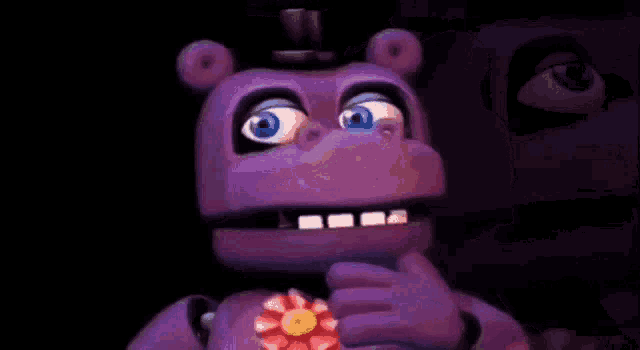 a purple stuffed animal with blue eyes and a top hat is looking at the camera .