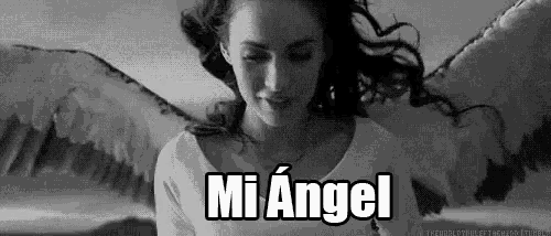 a black and white photo of a woman with angel wings and the words `` mi angel '' written above her .