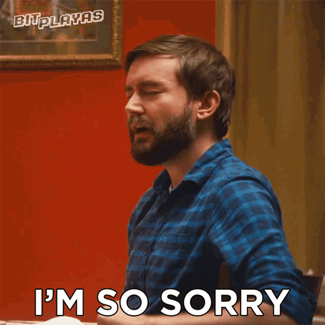 a man says i 'm so sorry with his hands up