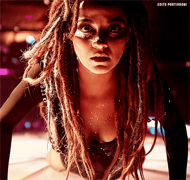 a close up of a woman with dreadlocks and the words edits portirroni below her