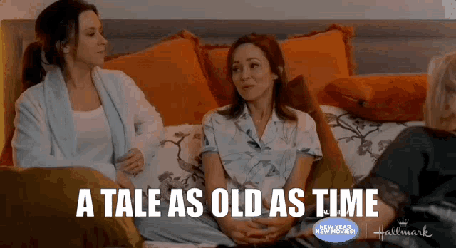 three women sitting on a bed with the words a tale as old as time