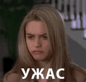 a woman with long blonde hair is making a funny face with a foreign language on her face .