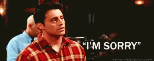a man in a plaid shirt is saying " i 'm sorry " .