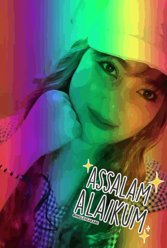 a woman wearing a white hat with the words assalamu alaikum written on it