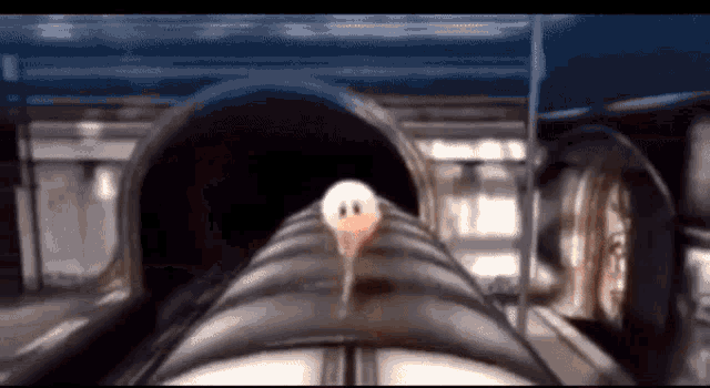 a white object with a face on it is going down a tube