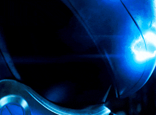 a close up of a blue object with a light coming out of it