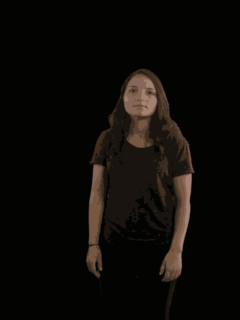 a woman with her arms outstretched looking up