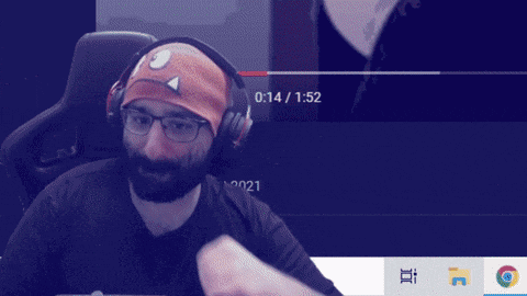 a man with a beard wearing headphones and a headband with a triangle on it
