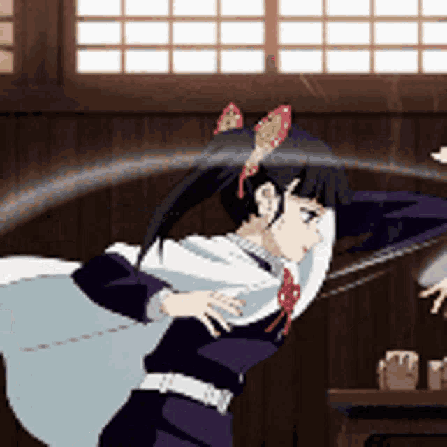 a girl with a butterfly in her hair is standing in a room .