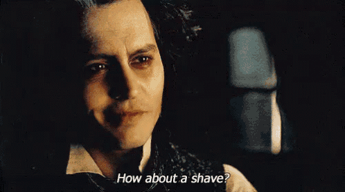 a close up of a man 's face with the words `` how about a shave '' .