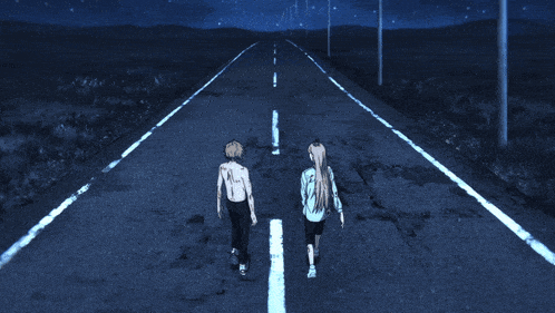 a boy and a girl are walking down a dark road